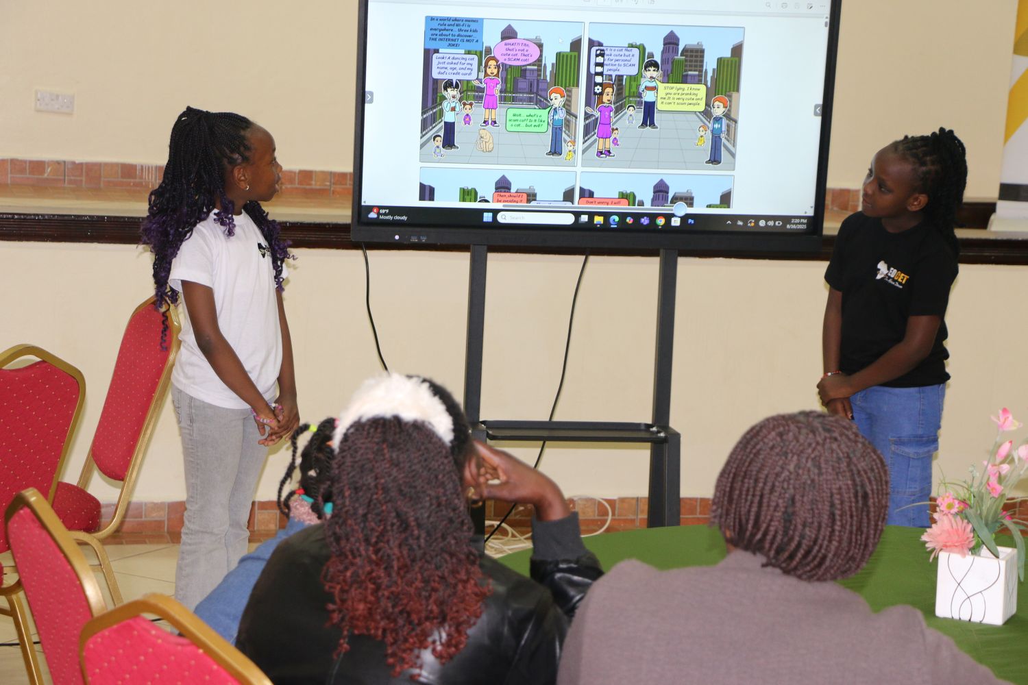 Techweavers academy learners (Precious and Tamara) in a session during a conference with parents - the comic book